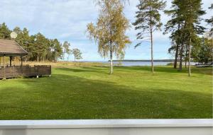 a park with a bench and a gazebo at 2 Bedroom Beautiful Home In Byxelkrok in Byxelkrok +6 photos