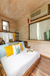a bedroom with a bed in a wooden cabin at Tiny house on Flower Farm in downtown Atlanta in Atlanta