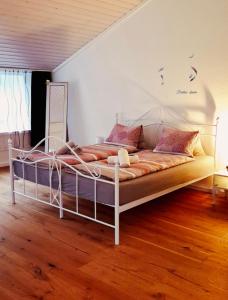 a bedroom with a white bed in a room at Muota River Loft & Muota Industry Apartment near Stoos in Muotathal