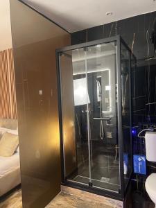 a glass shower in a room with a bed at Armonia Serenity Room Politeama in Palermo +46 photos