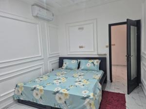 Ένα ή περισσότερα κρεβάτια σε δωμάτιο στο Une chambre salon avec cuisine