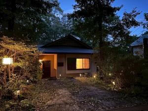 a small house with lights in front of it at Frolic Field Nasu in Nasu