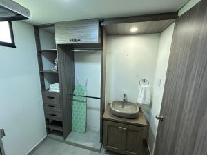 a bathroom with a sink and a shower at House 10 minutes from the airport, Rionegro in Rionegro +21 photos