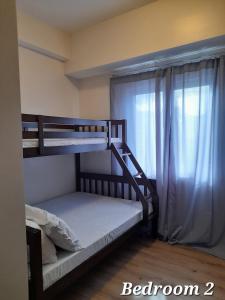 Postel nebo postele na pokoji v ubytování BE Residences IT Park Lahug, Cebu City