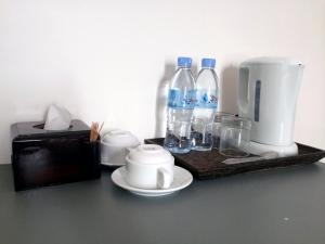 Příslušenství pro přípravu čaje a kávy v ubytování Sokha Home