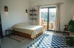 Ένα ή περισσότερα κρεβάτια σε δωμάτιο στο Villa Lala Argana