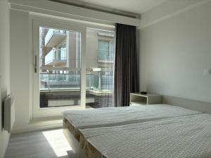 Voodi või voodid majutusasutuse Stylish 3-bedroom apartment with sea view toas