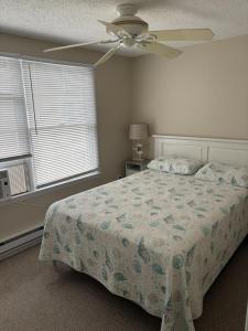 a bedroom with a bed and a ceiling fan at Holgate Ocean Front Duplex 2Nd Fl 14018 in Holgate