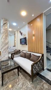 a living room with a couch and a table at Negmet Siwa Hotel in Siwa