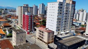 an aerial view of a city with tall buildings at Praia, Laser, Comércio in Praia Grande