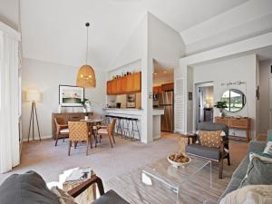 a living room with a couch and a table at Wailea Grand Champions 104 in Wailea