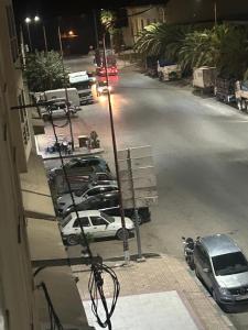 a view of a street with cars parked on the road at Très bel appartement spacieux in Taza +1 photo