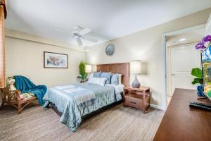 En eller flere senge i et værelse på Valley Isle Resort Unit 802