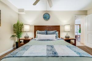 a bedroom with a bed and two lamps at Oceanfront Kahana Condo Ocean View, Beachfront, Pool & Sleeps 4, Walkable Area in Lahaina