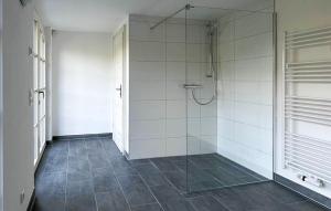 a bathroom with a shower with a glass door at Nice Apartment In Südharz With Sauna in Stolberg i. Harz