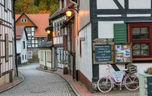 a bike parked on the side of a building on a street at Nice Apartment In Südharz With Sauna in Stolberg i. Harz +21 photos