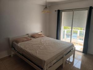 Postel nebo postele na pokoji v ubytování Oualidia résidence Ben zeroual