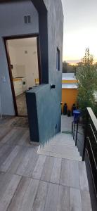 a view of a house with a patio at Los Pecos Hospedaje in Ostende