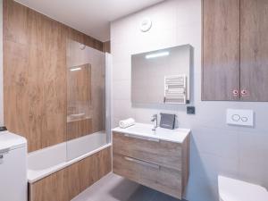 a bathroom with a sink and a toilet at Appartement skis aux pieds avec 8 couchages à l'Alpe d'Huez - FR-1-645-96 in L'Alpe-d'Huez
