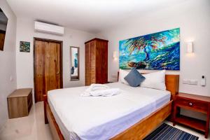 Ένα ή περισσότερα κρεβάτια σε δωμάτιο στο ZenBreak Hammock Suite Shack-Shack