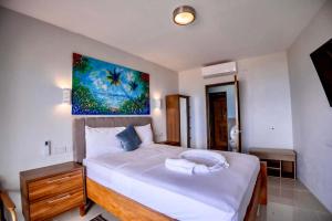 Ένα ή περισσότερα κρεβάτια σε δωμάτιο στο ZenBreak Hammock Suite CoCo-Nut