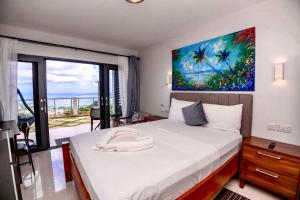 Ένα ή περισσότερα κρεβάτια σε δωμάτιο στο ZenBreak Hammock Suite CoCo-Nut