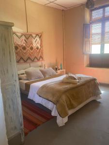 Ένα ή περισσότερα κρεβάτια σε δωμάτιο στο Refugio Caro Cox