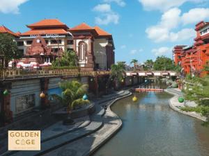 a view of a river in a city with buildings at Golden Cage Heritage Hostel in Denpasar
