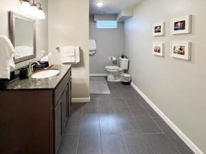 a bathroom with a sink and a toilet at Bourbon Blue - 8 min to Downtown Bardstown and Spacious! in Bardstown +98 photos