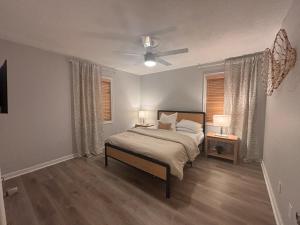 a bedroom with a bed and a ceiling fan at Stylish Stay in the Heart of Decatur King Bed in Decatur