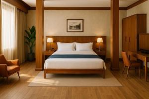 a bedroom with a bed and two chairs and a desk at DB Ardena Holis in Rawang