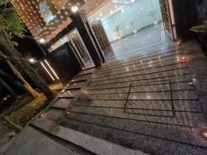 a set of stairs in front of a building with lights at Cozy and Tranquil nest with wifi and homely care in Greater Noida
