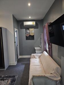 a room with a bed in the corner of a room at Beautiful New 3 Bed 3 Bathroom Villa 400m to Bang Tao Beach Sleeps 9 in Ban Thalat Choeng Thale +12 photos