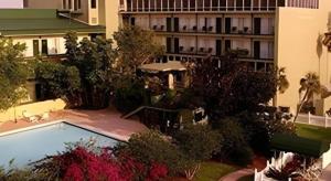 an overhead view of a building with a swimming pool at Magnuson Grand Conference Hotel in Cypress Gardens