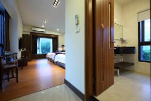 Postel nebo postele na pokoji v ubytování 雲起軒民宿 Cloudscape B&B