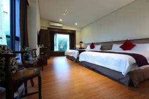 Postel nebo postele na pokoji v ubytování 雲起軒民宿 Cloudscape B&B