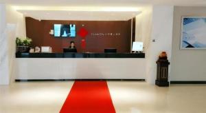 a lobby with a red and white stripe on the floor at City Comfort Inn Wuhan Hangkong Road Tongji Hospital in Wuhan