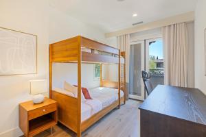 a bedroom with a bunk bed and a desk at @ Marbella Lane - 4BR Mediterranean-style Home in Newport Beach +53 photos