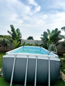 a swimming pool in a yard with at Aasa Farmhouse in Hyderabad