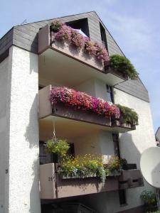 a building with flower boxes on the side of it at WohnZeit Stuttgart in Stuttgart