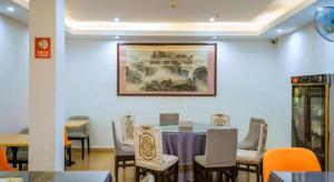 a dining room with a table and chairs at Borrman Hotel Guilin Elephant Hill Park Li Lake in Guilin