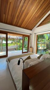 Postel nebo postele na pokoji v ubytování Villa Alamiah Mentawais