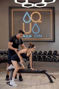 a man and a woman sitting on a treadmill at The Light Arena Ocean Tower in Cam Ranh International Airport +76 photos
