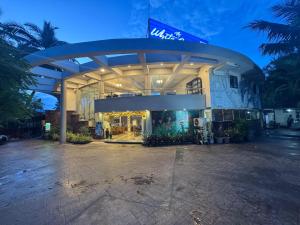 a building with a sign on top of it at White Sands Resort & Spa in Varca