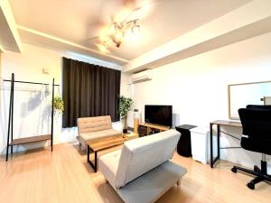 Televiisor ja/või meelelahutuskeskus majutusasutuses Excel 中島公園 -FIX HOME-