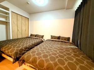 Voodi või voodid majutusasutuse Excel 中島公園 -FIX HOME- toas