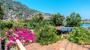 a view of a garden with flowers on a roof at Dalyan Pension in Dalyan