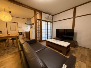 TV a/nebo společenská místnost v ubytování Private House HidaTakayama