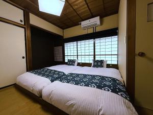 Postel nebo postele na pokoji v ubytování Private House HidaTakayama