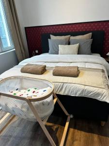 a bedroom with a bed with a tray on it at Lovely 1BR & 1LR Apartment, Only 15 Min Walk to City Center in Ghent